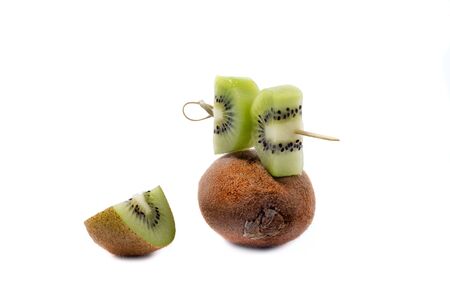ripe kiwi fruit slices isolated on White Backgroundの写真素材