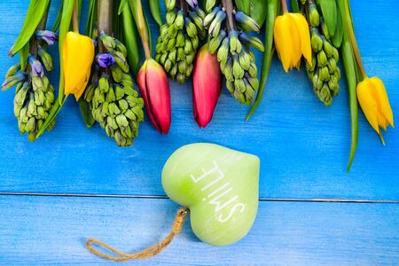 Tulips and hyacinths on a wooden table, heart, love, Valentine's Day