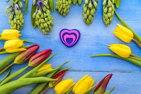 Tulips and hyacinths on a wooden table, heart, love, Valentine's Day