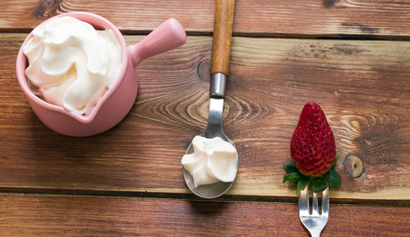 Fresh strawberries on a wooden background. top vegetarian, fruit, farm, dessert, diet, health, organicの写真素材