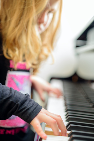 girl playing the piano, piano, piano keyboardの写真素材