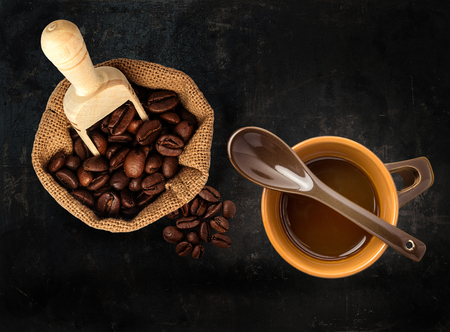 cap of coffee beans on black backgroundの写真素材