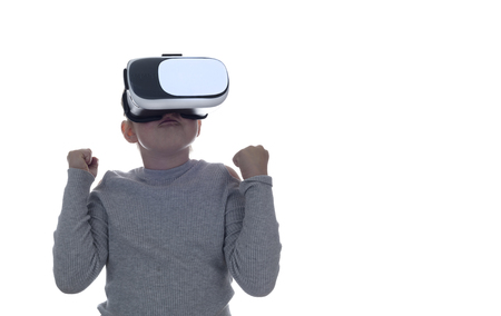 Girl using a virtual reality headset . Isolated on white backgroundの写真素材