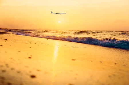 Travel concept with aircraft. Clouds and seaの写真素材