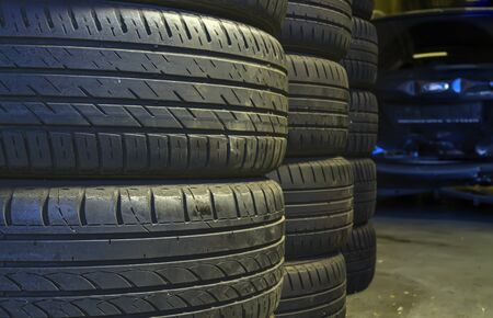 Stacked used auto tires in car service center. Auto repair.  Service center