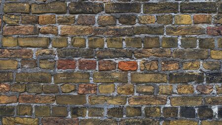 Old stone wall background. Background with Old Vintage Dirty Brick Wall, Texture. Shabby Building Facade の写真素材