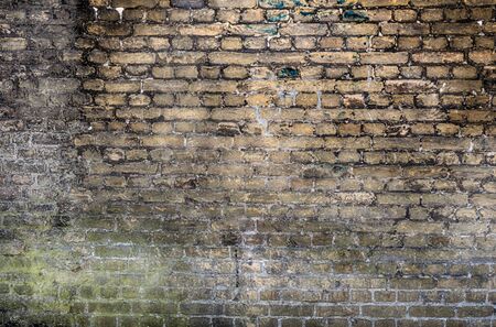 Old stone wall background. Background with Old Vintage Dirty Brick Wall, Texture. Shabby Building Facadeの写真素材