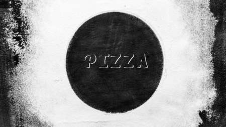 Flour and Text PIZZA on old shabby black baking sheet. Baking background. Top View