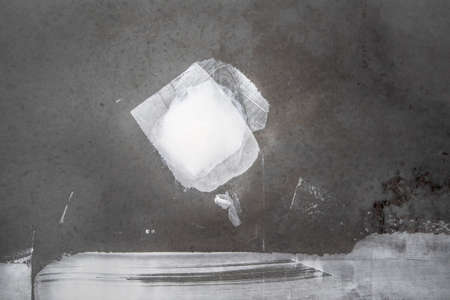 Construction background. Gray concrete wall with white putty.