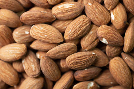 Selective focus.Macro shooting of dry Almond Nuts.Vegetarian food rich in minerals and vitamins.の写真素材