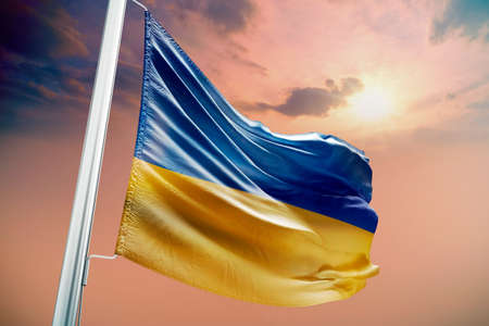 flag. Ukraine. The flag of Ukraine flutters in the blue sky