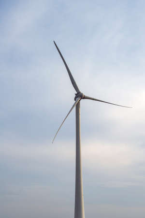 Wind turbines rotate, producing clean, renewable energy.