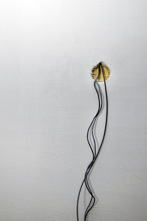 Electric wire and junction box on an old shabby wall. home renovation conceptの写真素材