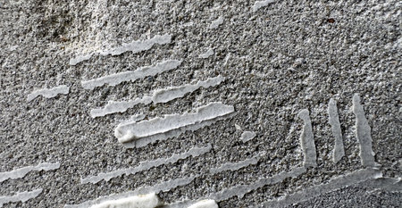 Fragment of an old, shabby, rough wall for the backgroundの写真素材