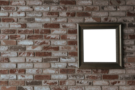 Vintage wooden frame with space for your design on an old brick wall