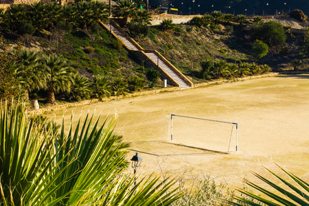 football field located in the mountains near the villageの写真素材