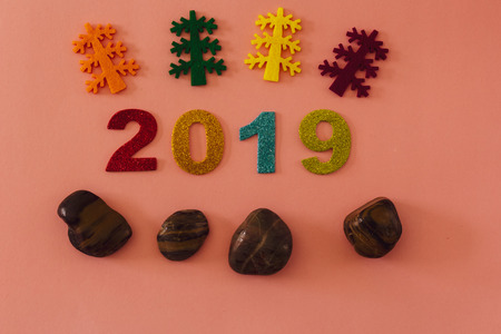 Happy New Year 2019 on a pink backgroundの写真素材