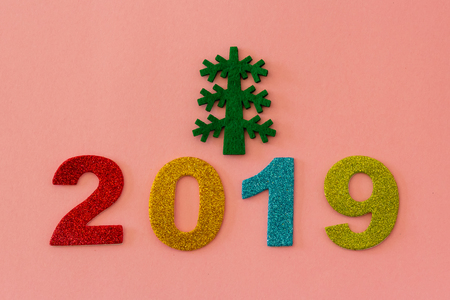 Happy New Year 2019 on a pink backgroundの写真素材