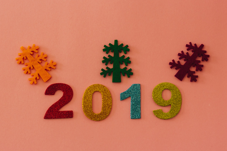 Happy New Year 2019 on a pink backgroundの写真素材