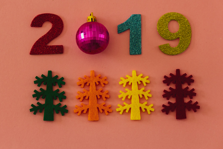 Happy New Year 2019 on a pink backgroundの写真素材