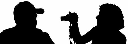 silhouette men and women with a cameraの写真素材