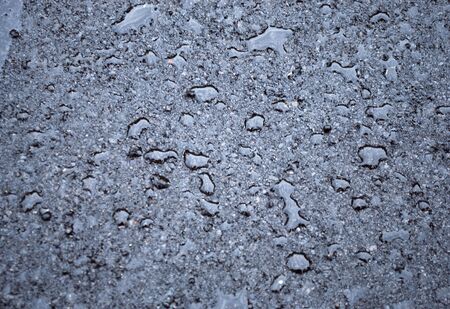 drops of rain water on a fresh asphalt