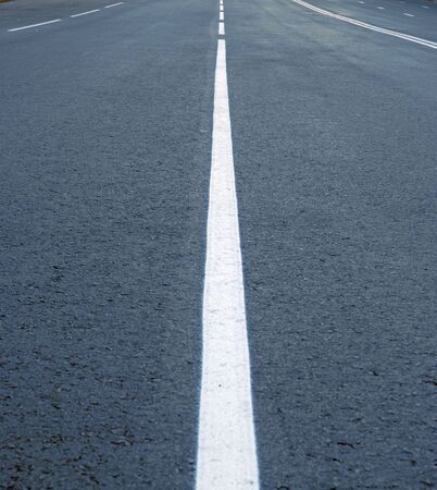 asphalt road line,  dividing lines on the highwayの写真素材