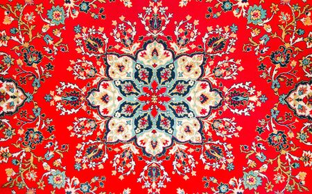 fragment of picture of age-old east carpet. A background is in Persian styleの写真素材