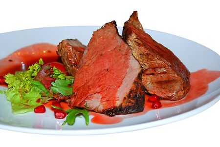 slices of ham, piece of smoked meat in a pomegranate sauceの写真素材