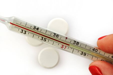 thermometer and pills as pharmaceutical background