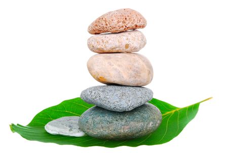 five varicoloured stones in zen balance
 isolated on whiteの写真素材