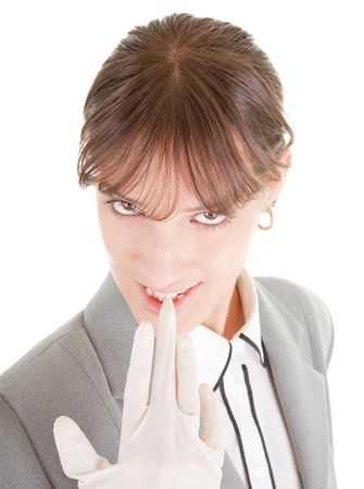 portrait of business woman, lifting latex glove with teethの写真素材