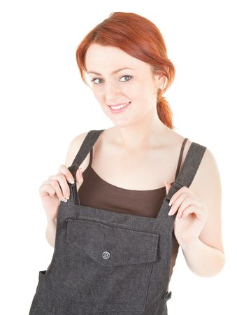portrait of red haired girl in overalls の写真素材