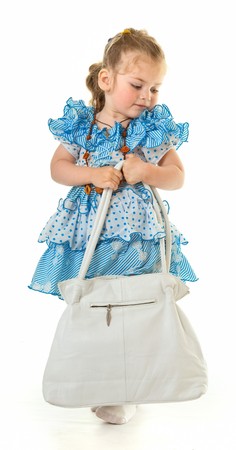 Fashion-monger. Girl in blue dress with a bagの写真素材