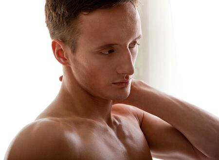 young man - sportsman with a bare torsoの写真素材