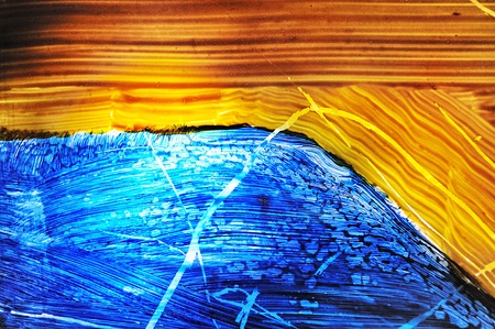 artistic background in style of strokes of paint and rays of lightの写真素材