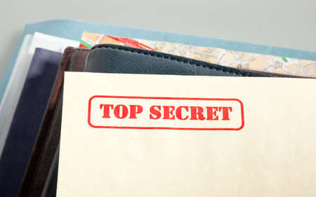 marked "top secret" on a pile of documentsの写真素材