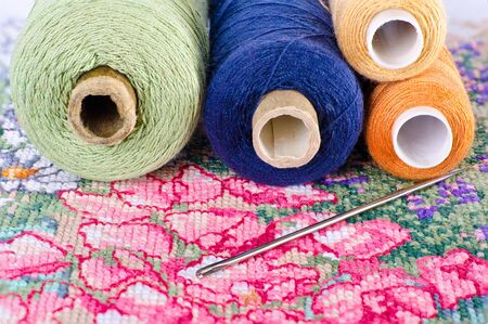 thread in the coils and needle on hand embroidery. The image collected from five shots to increase the zone of focusの写真素材