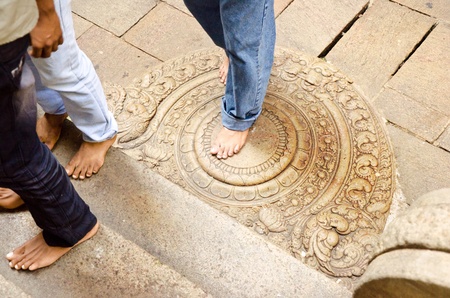 TEMPLE OF SACRED TOOTH RELIC IN KANDY, SRI LANKA, DECEMBER 8  traditional  moon  stone at the entrance to the temple  Before entering must remove shoes  TEMPLE OF SACRED TOOTH RELIC IN KANDY, SRI LANKA, DECEMBER 8, 2011のeditorial素材