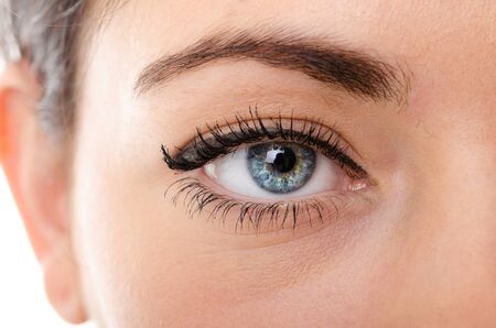 the eyes of a young woman is very closeの写真素材