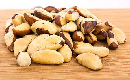 Bertholletia Brazil nuts on wooden texture