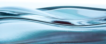 close-up of water wave against white backgroundの写真素材