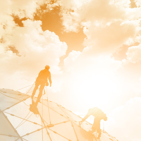 unrecognizable refurbishment work on a skyscraperの写真素材