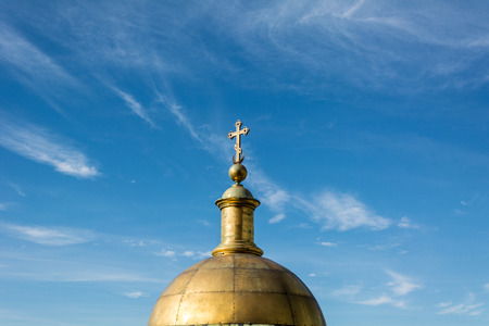 ST. PETERSBURG, RUSSIA - JULY 14, 2016: golden dome of the Christian cathedral on a background of...