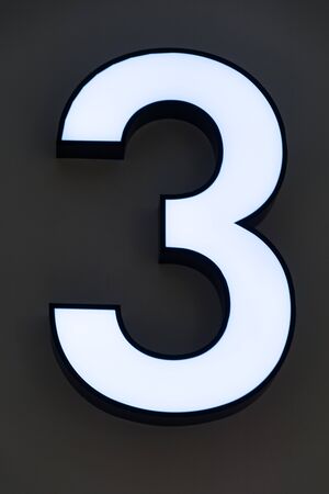 Number 3 Neon sign on the wallの写真素材