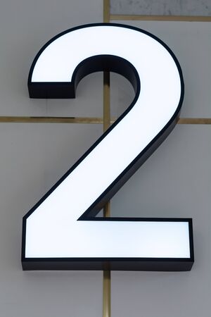 Number 2 Neon sign on the wall