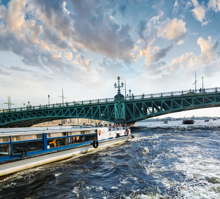 ST. PETERSBURG, RUSSIA - JULY 14, 2016: Boat floats on the background of the drawbridge in St. Petersburg.のeditorial素材