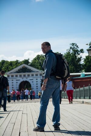 ST. PETERSBURG, RUSSIA - JULY 11, 2016: Tourist walking on the footbridge in the Peter and Paul Fortress, St. Petersburg, Russiaのeditorial素材