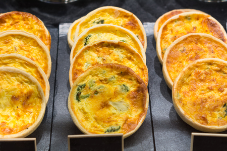 quiche on the counter with a price tagの写真素材