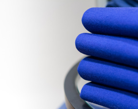 stack of neatly folded clothes on the counter